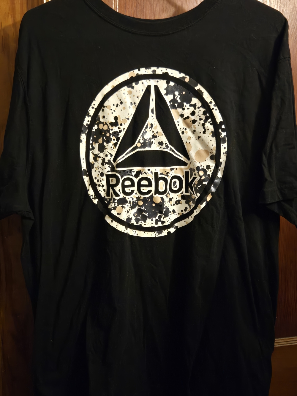 Reebok Black Short-Sleeve Tee with White and Brown Splatter Logo